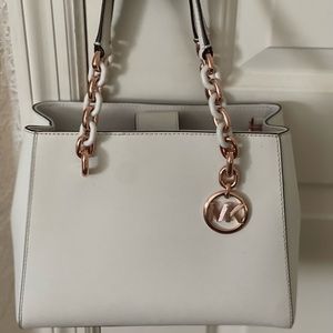 Michael Kors purse, White purse with pink rose accents with matching wallet.